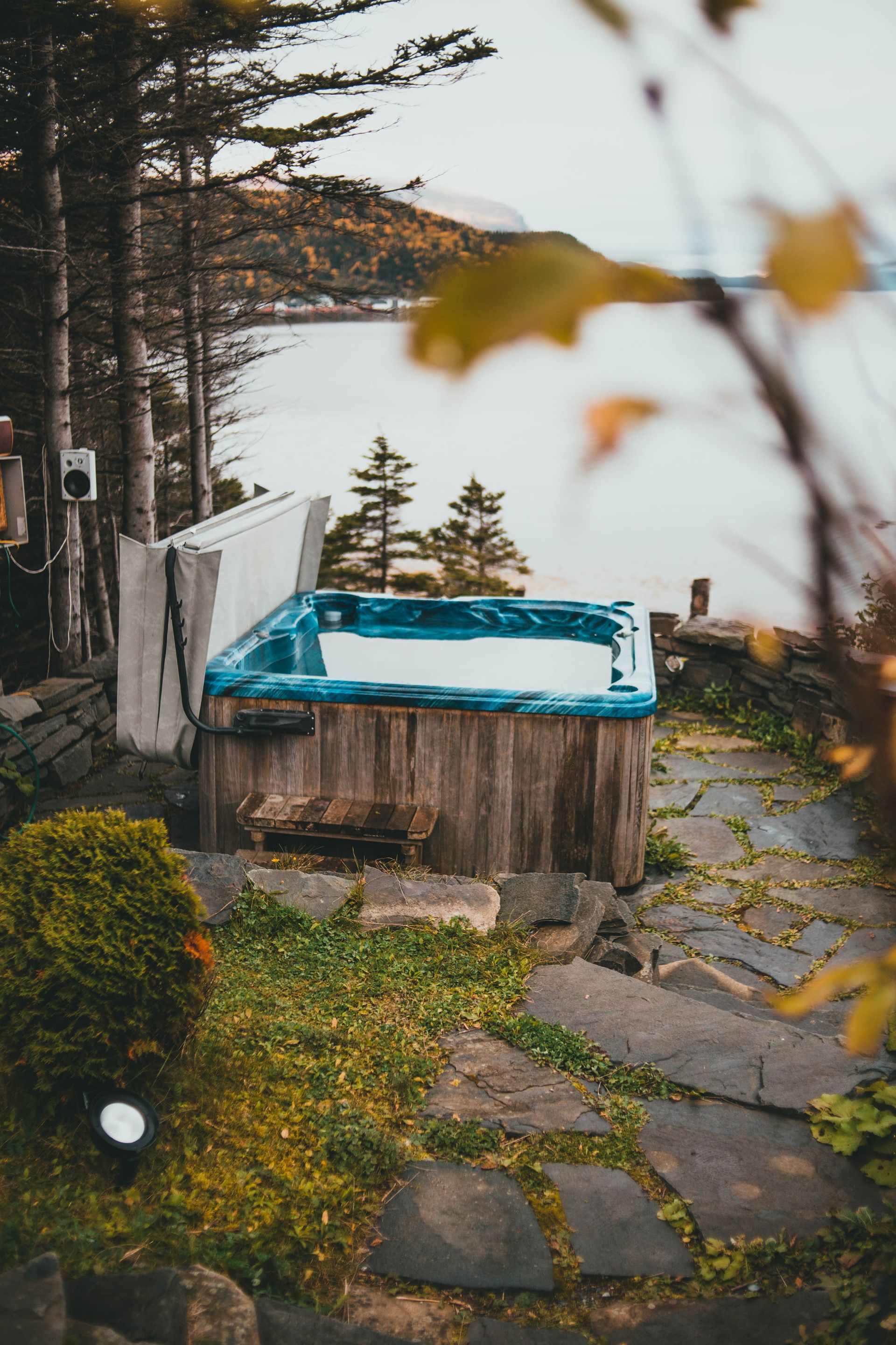 A refurbished hot tub set up in a backyard